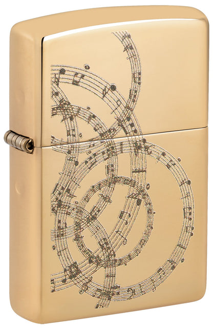 Gold Zippo lighter with intricate music sheet design P1